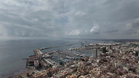 aerial view of a coastal city with harbor and marina