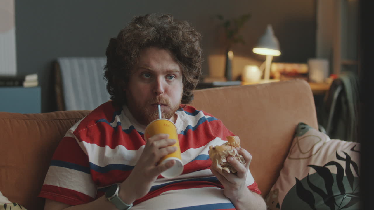 Man Eating and Watching TV