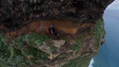 A-strong-and-active-man-is-walking-on-the-trail-up-to-Quebrada-do-Negro-in-Madeira