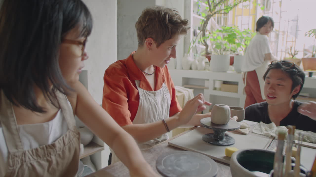 Woman Learning Pottery on Masterclass in Ceramics Studio