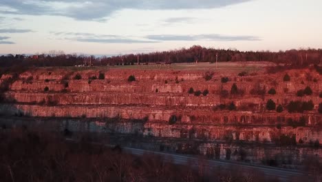 slow aerial trucking pan of upper cove spring park in frankfort, kentucky during the sunset golden hour