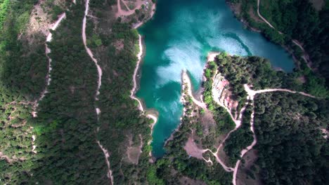 Drone-hyperlapse-bird-eye-view-above-lake-Tsivlou-in-the-mountains-of-Peloponnese-in-Greece