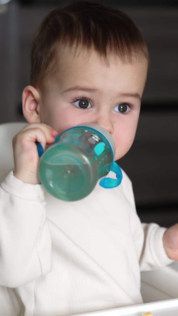 Baby eating and drinking