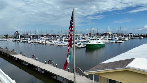 aerial approach of trawler near a waterfront home in new orleans marina