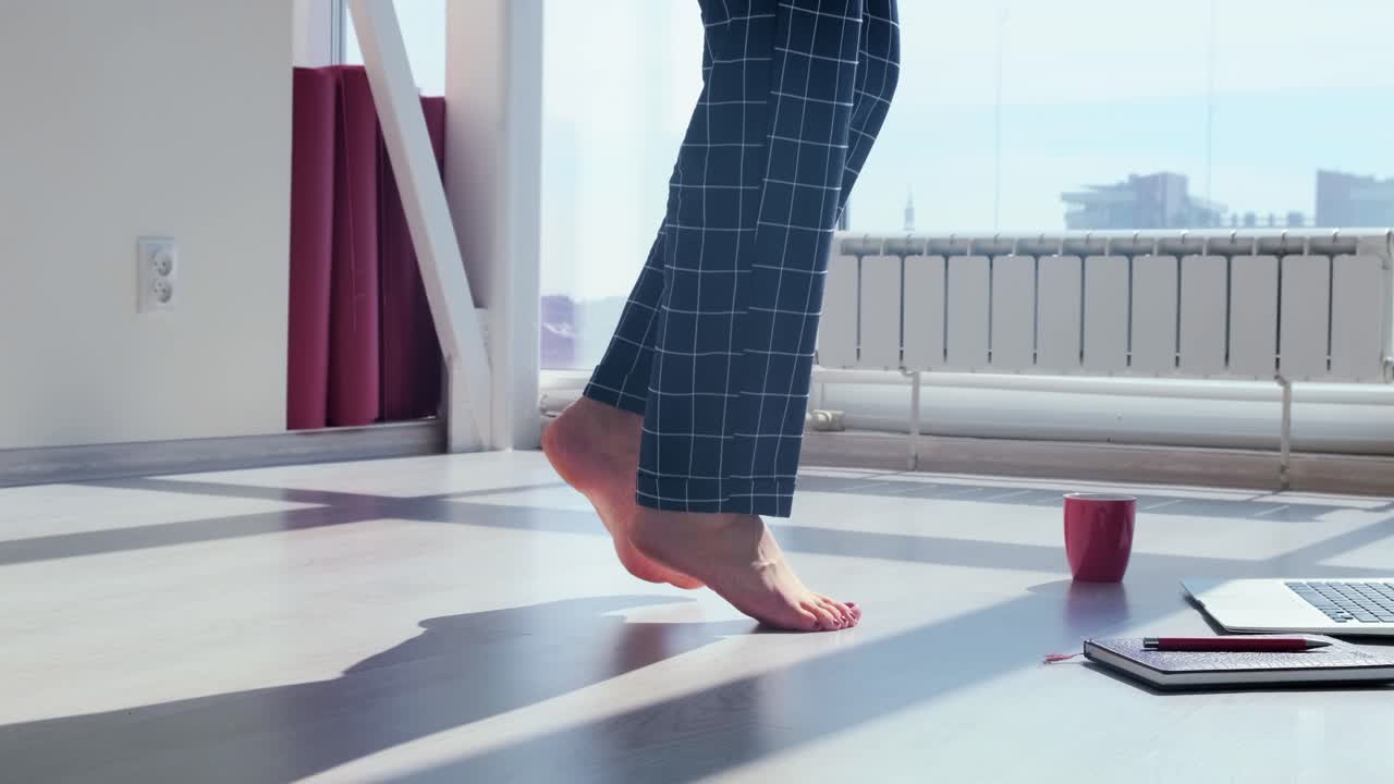 Woman walking barefoot in pajamas