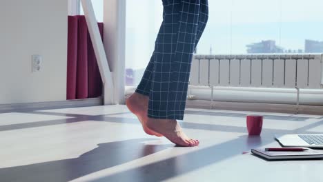 woman walking barefoot in pajamas