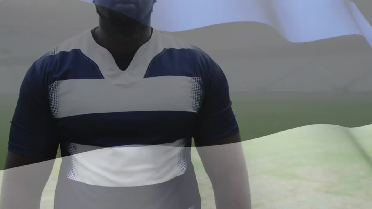 animación de la bandera estonia ondeando sobre un jugador de rugby afroamericano