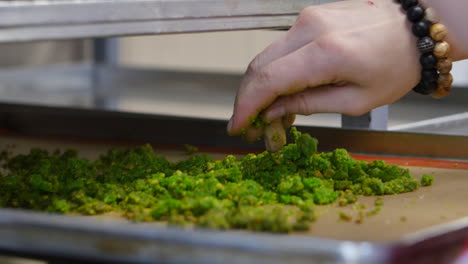 preparing a green cookie topping