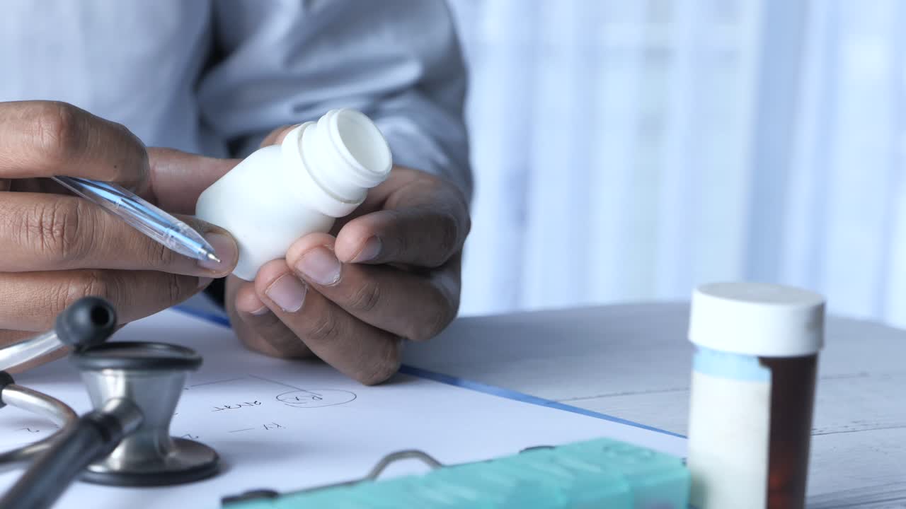Doctor reviewing medication with patient
