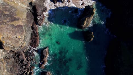 Rocky-Coastline-in-Cornwall-at-Bedruthan-Steps-with-a-Top-Down-View-from-an-Aerial-Drone