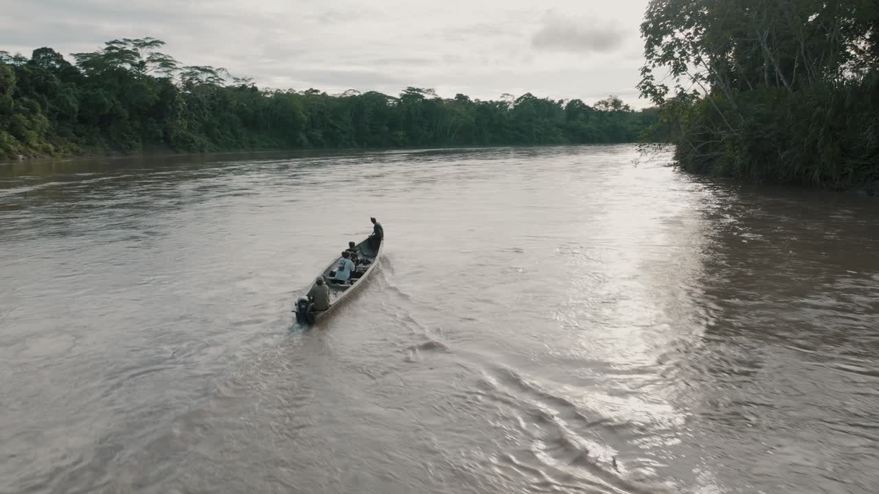 Boat With Tourists Touring The Amazon River In Ecuador - aerial drone shot
