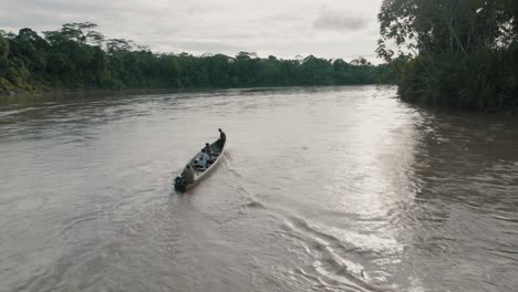 boat with tourists touring the amazon river in ecuador - aerial drone shot