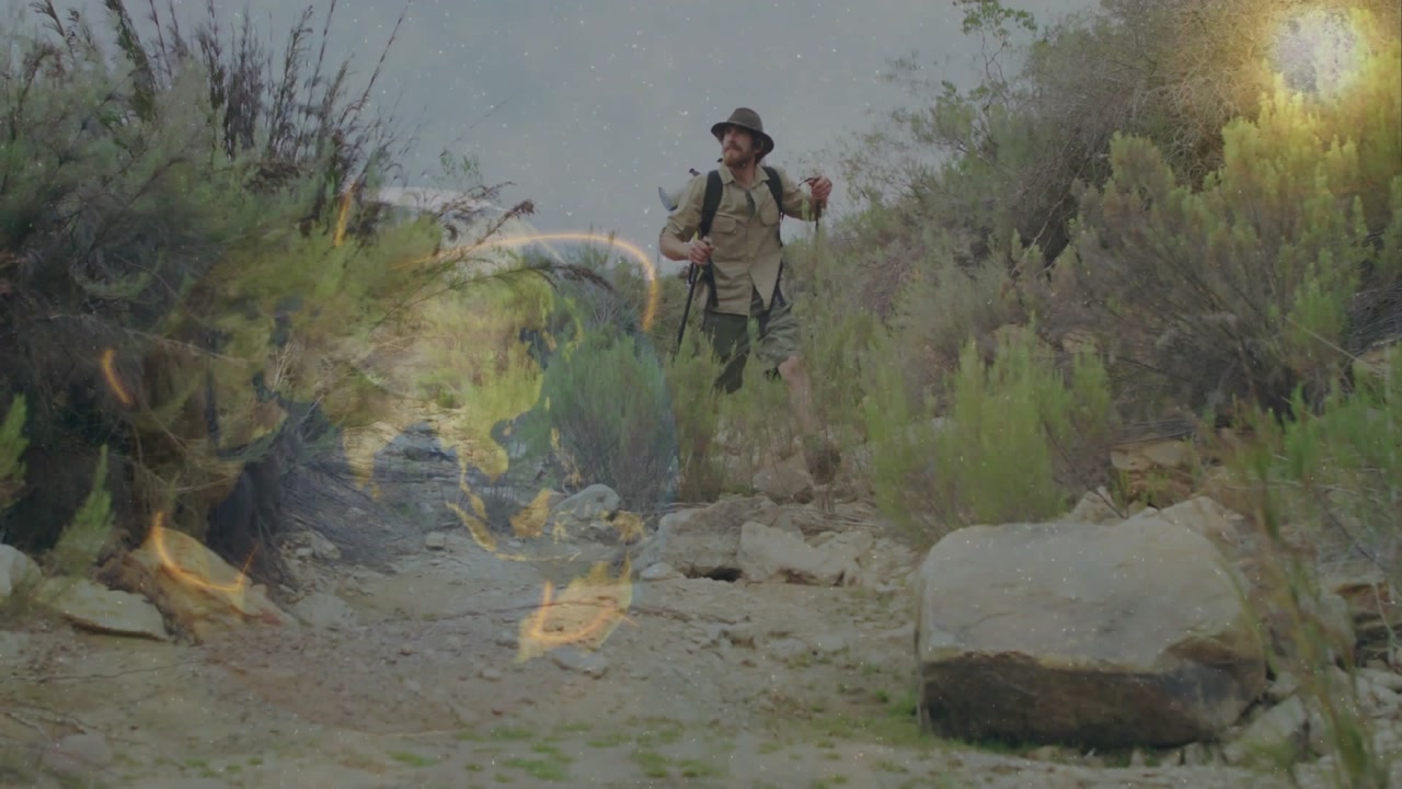 Man Hiking on a Rocky Trail with Digital Global Map Overlay