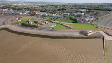 morecambe seaside town from above with grassy headland. proposed site for eden project. summer. marine road central, morecambe, lancashire, uk
