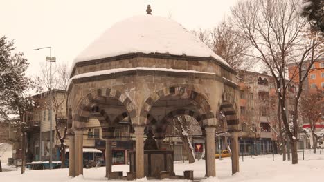 erzurum in turkey 03. 01. 2021.
snow is falling on a dome over an ancient water source.
islamic ancient building, cold weather -50 degrees celsius.
snowfall in the winter.
ice, freezing, frozen