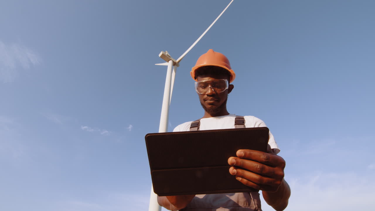 Wind Turbine Technician Inspecting Equipment