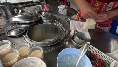 making and serving soy milk delicacy