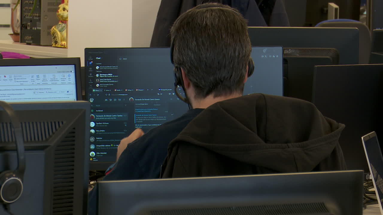 Person Working on Computers in an Office