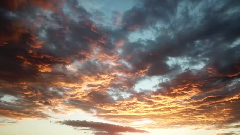 Drone-shot-of-dramatic-orange-clouds-at-sunset