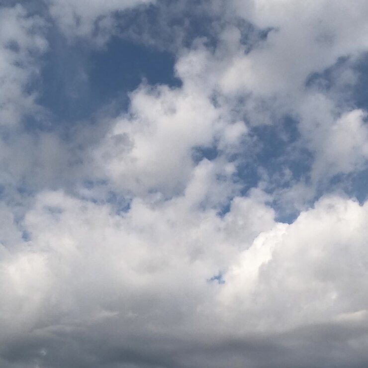 White soft cloudscape accumulating in the atmosphere. Rainy clouds gathering in the sky. Timelapse