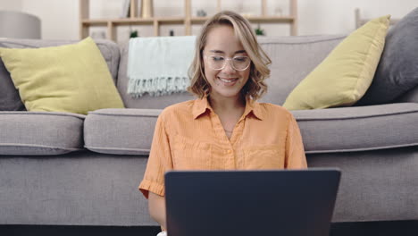 Search,-laptop-and-smile-with-woman-in-living-room