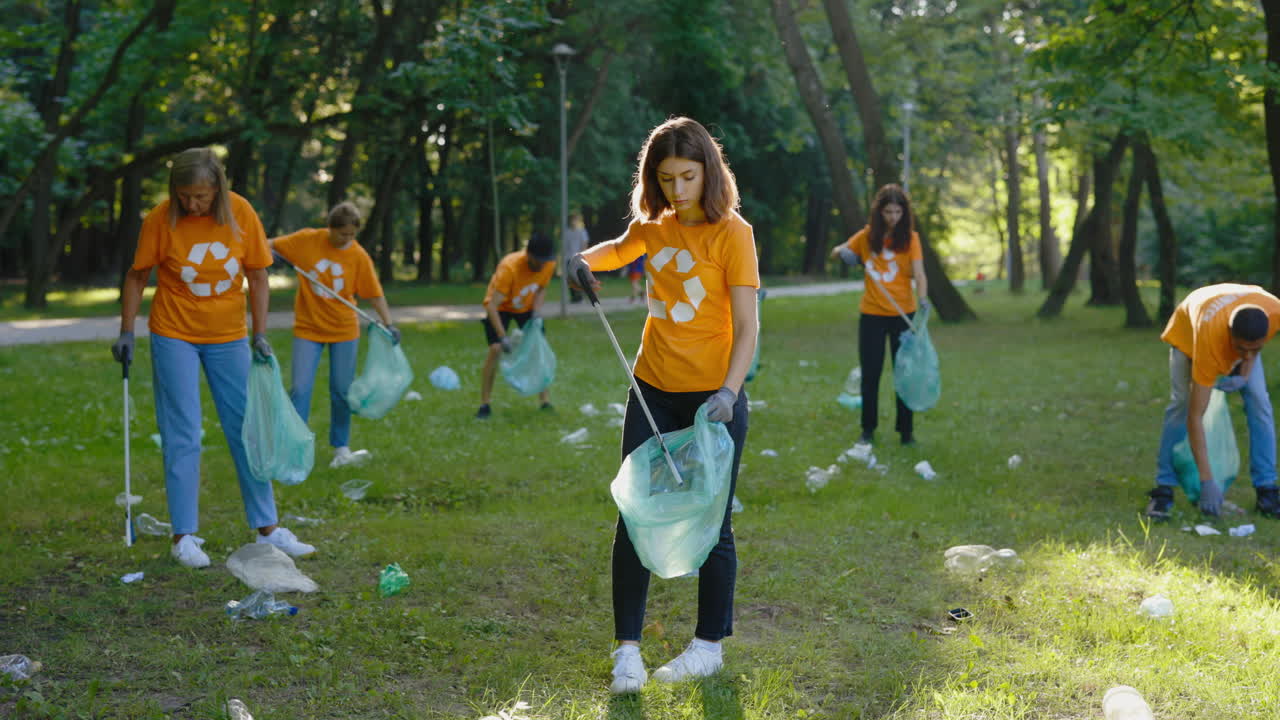 Group of People Volunteering to Clean Up Park