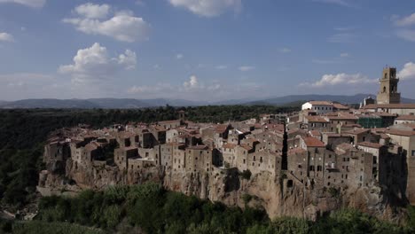 -shot: slider, side to birds eye
-description: drone video over the side of pitigliano, italy
-hour