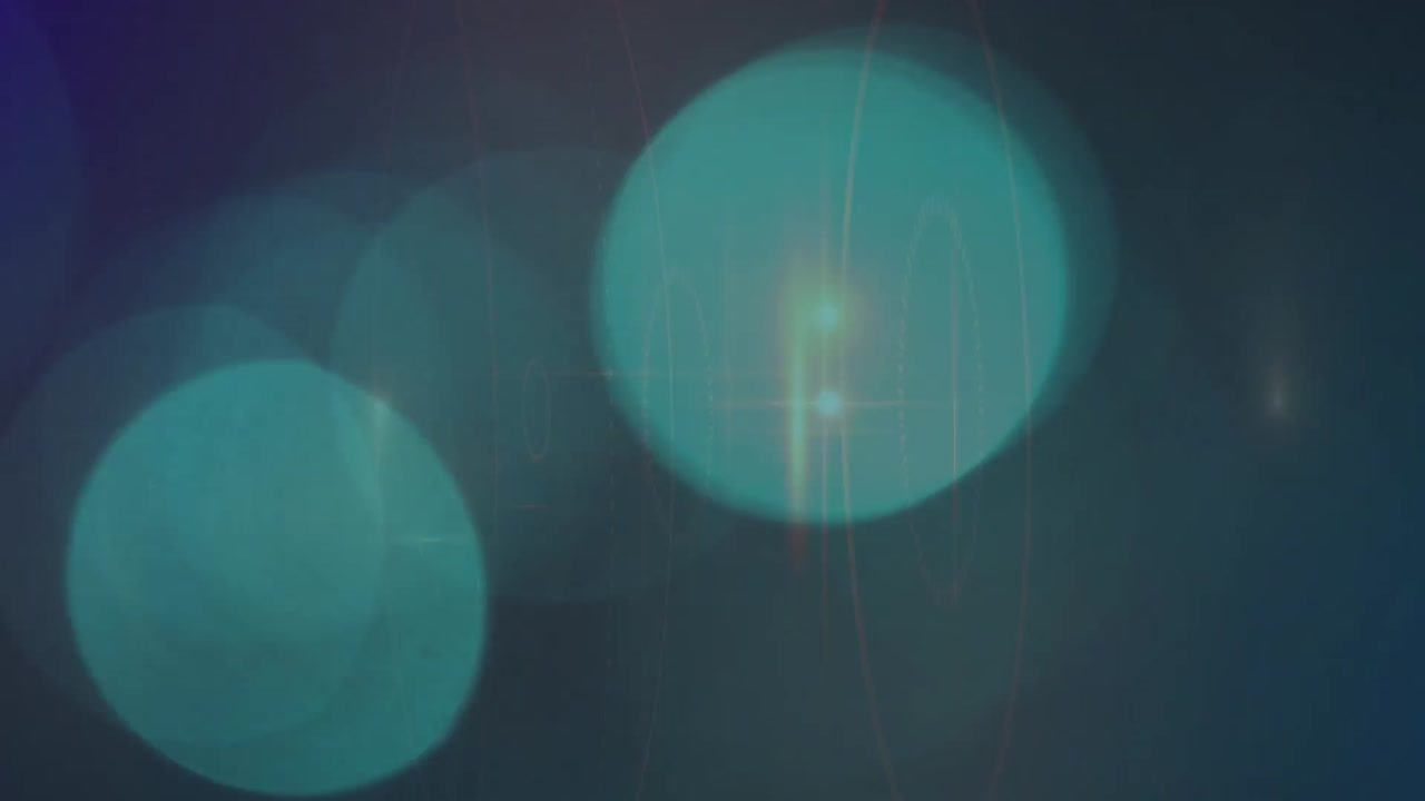 녹색 배경에 빛의 반점 위에 떨어지는  ⁇  입자의 애니메이션