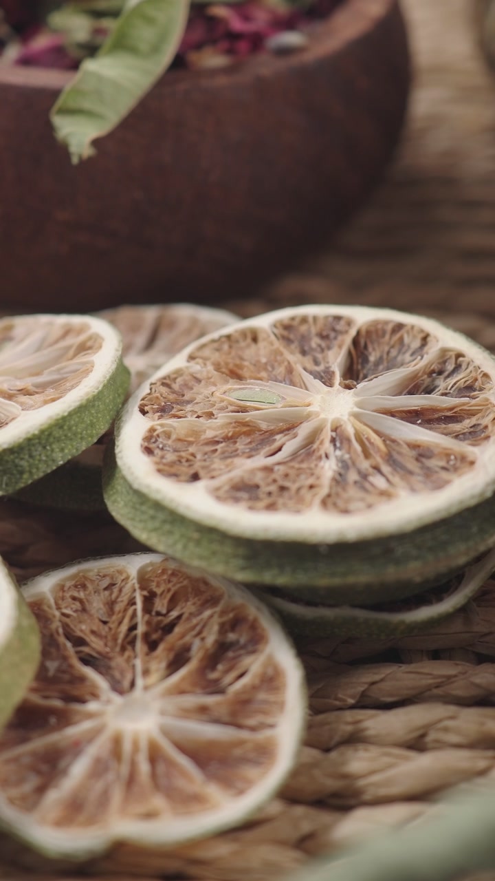 Close-up of Dried Lime Slices on a Rustic Woven Surface