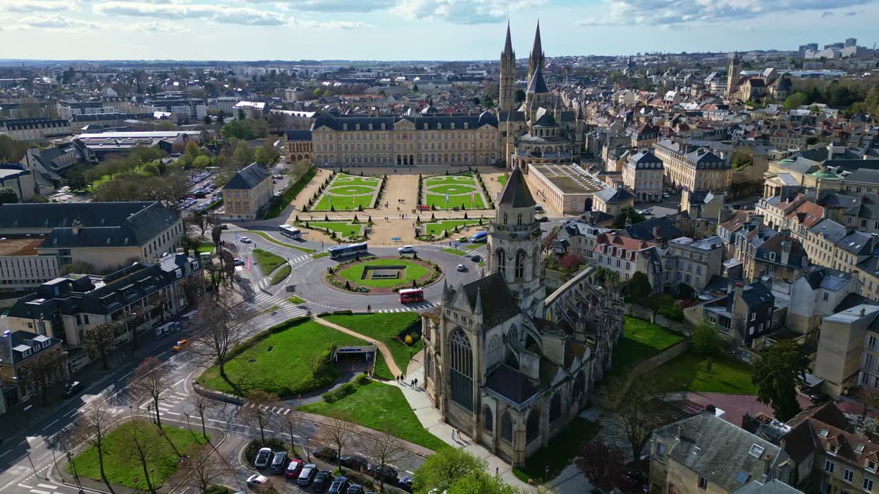 Caen town hall, historic Eglise Saint-Étienne-le-Vieux church ruins, Abbaye aux Hommes or Abbey men, cityscape, France. Aerial drone lateral