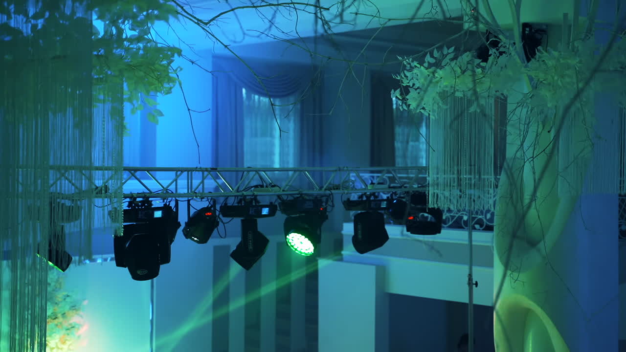 Floodlights scene during concert. View of stage with smoke and spotlights