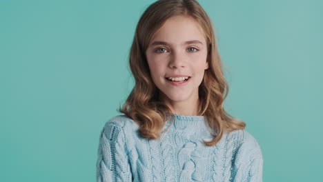 teenage caucasian girl making funny faces in front of the camera.