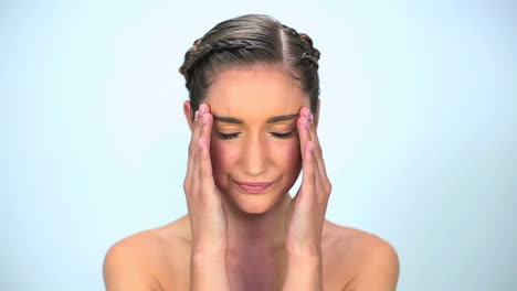 Nervous-young-woman-put-her-hands-on-temples