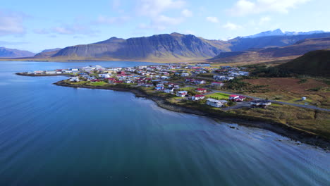 icelandic small town of grundarfjordur from afar at sunny day