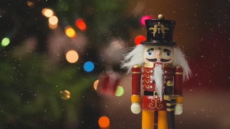 Animation-of-snow-falling-over-close-up-of-nutcracker