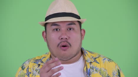 young handsome overweight asian tourist man