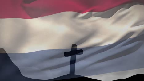 Animation-of-christian-cross-and-flag-of-netherlands