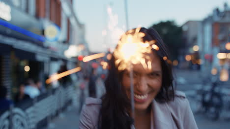 Beautiful-Indian-Woman-walking-with-sparkler-in-the-city