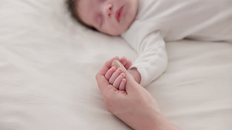 sleeping, holding hands or mother with infant