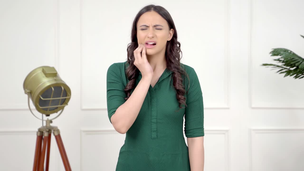 Indian girl having tooth pain