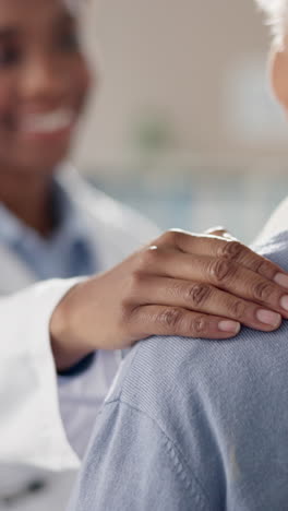 doctor comforting a patient by placing a hand on their shoulder