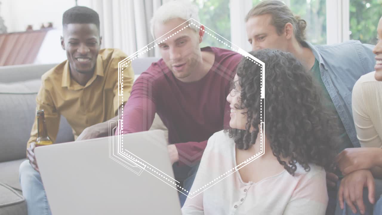 Friends pointing at silver laptop and watching hexagon overlay emerging and showing tech teamwork