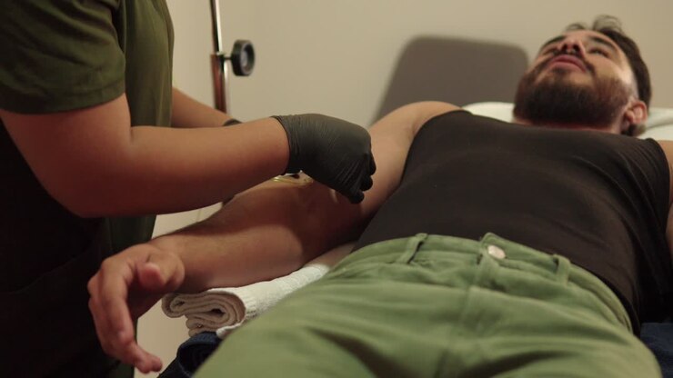 latin mexican soldier handsome male muscular model beard in nursery spa vitamin iv drip treatment retire tape from nurse hospital intravenous therapy multi