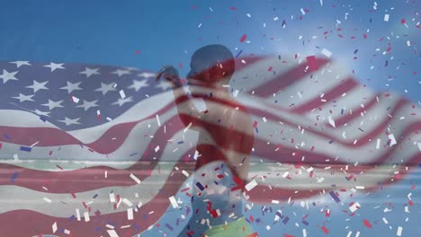 animation of american flag and confetti over african american man at beach