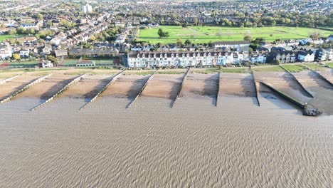 Row-of-seafront-houses-Whitstable-seaside-town-Kent-UK-Drone,-Aerial