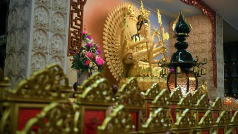 Golden-Buddha-Inside-Fo-Guang-Shan-Chung-Tan-Temple-In-Brisbane,-Queensland---tilt-up-shot