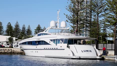 a yacht docking at a marina in gold coast