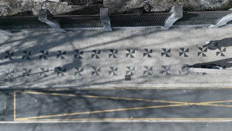 aerial view of portuguese stone pattern in middle of lisbon, portugal