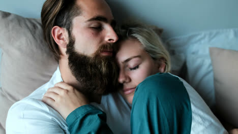 couple relaxing on bed in bedroom 4k