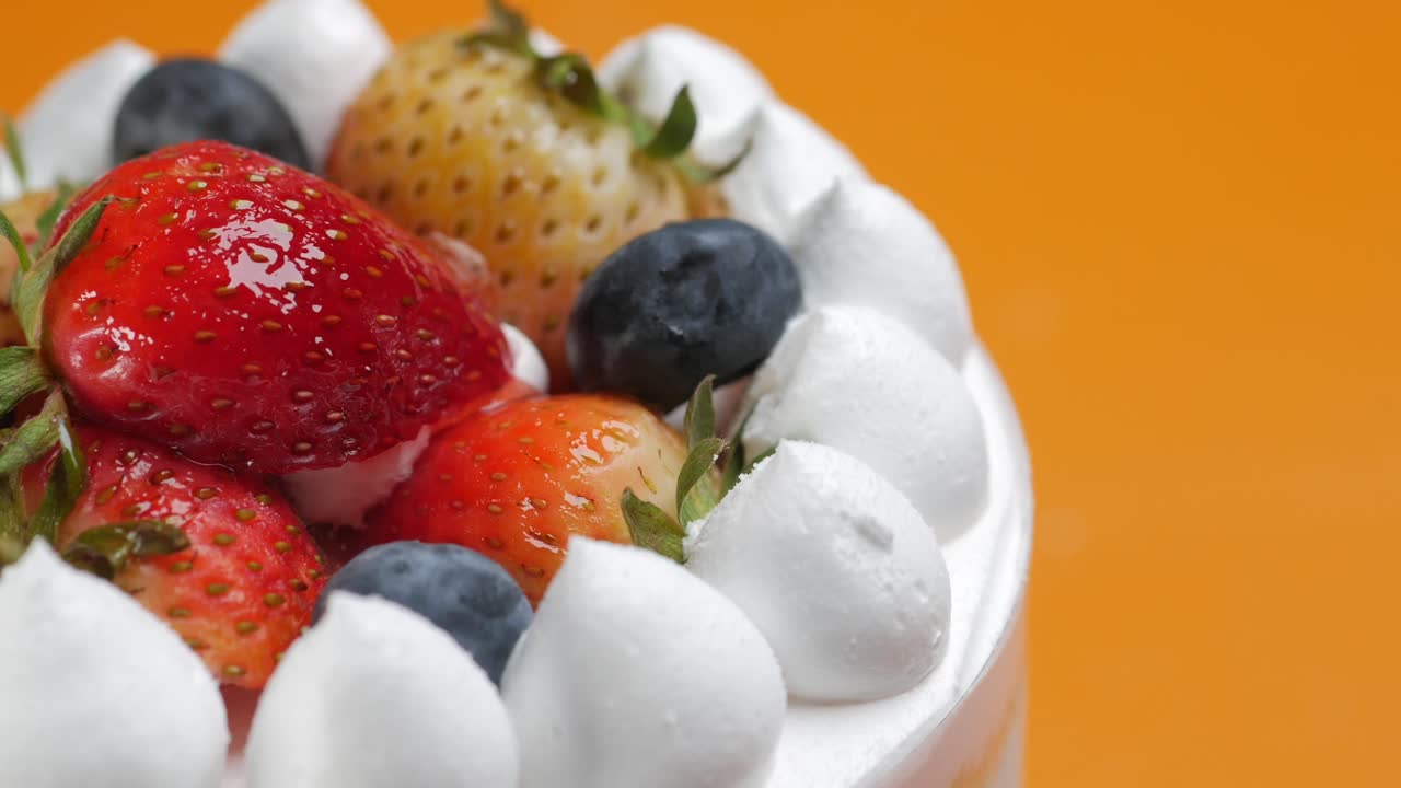 Close-up of a Fruit Cake with Whipped Cream